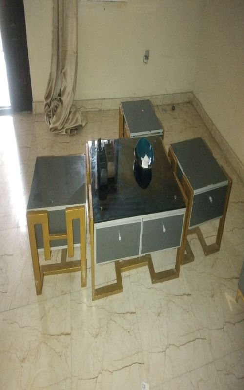 Glass top center table and 5 side stools all comes with drawers attached